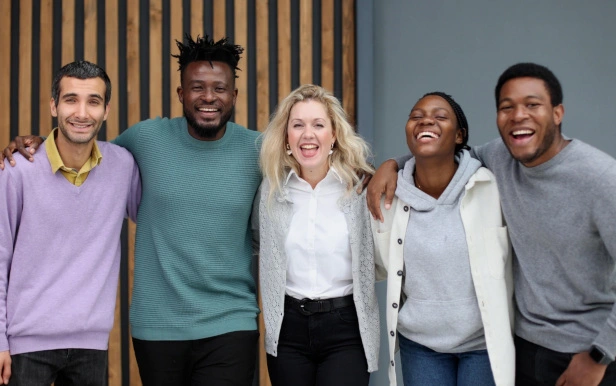 Group of colleagues in a company with integrated professionals laughing together
